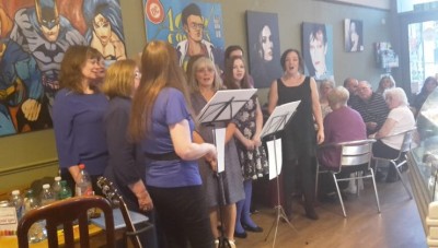 Group of ladies from Dynamic Meladies performing at Big Mouth Coffee Co