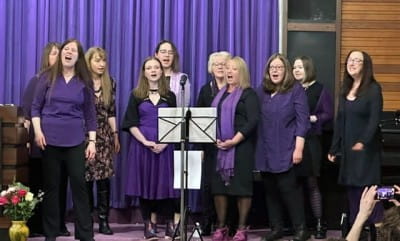 Group from Dynamic Meladies performing on stage