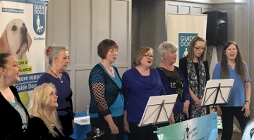 Group from Dynamic Meladies performing at Guide Dogs' Volunteer event